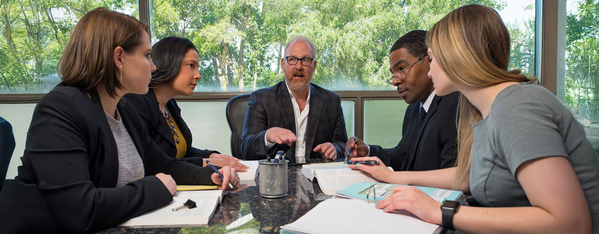 Lyngklip & Associates meeting around a conference table