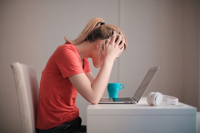 stressed woman at computer